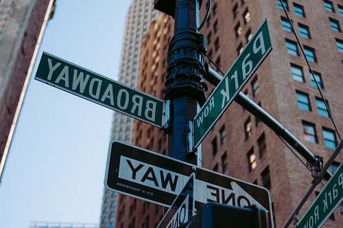 symbol low-angle photography of street signage road sign